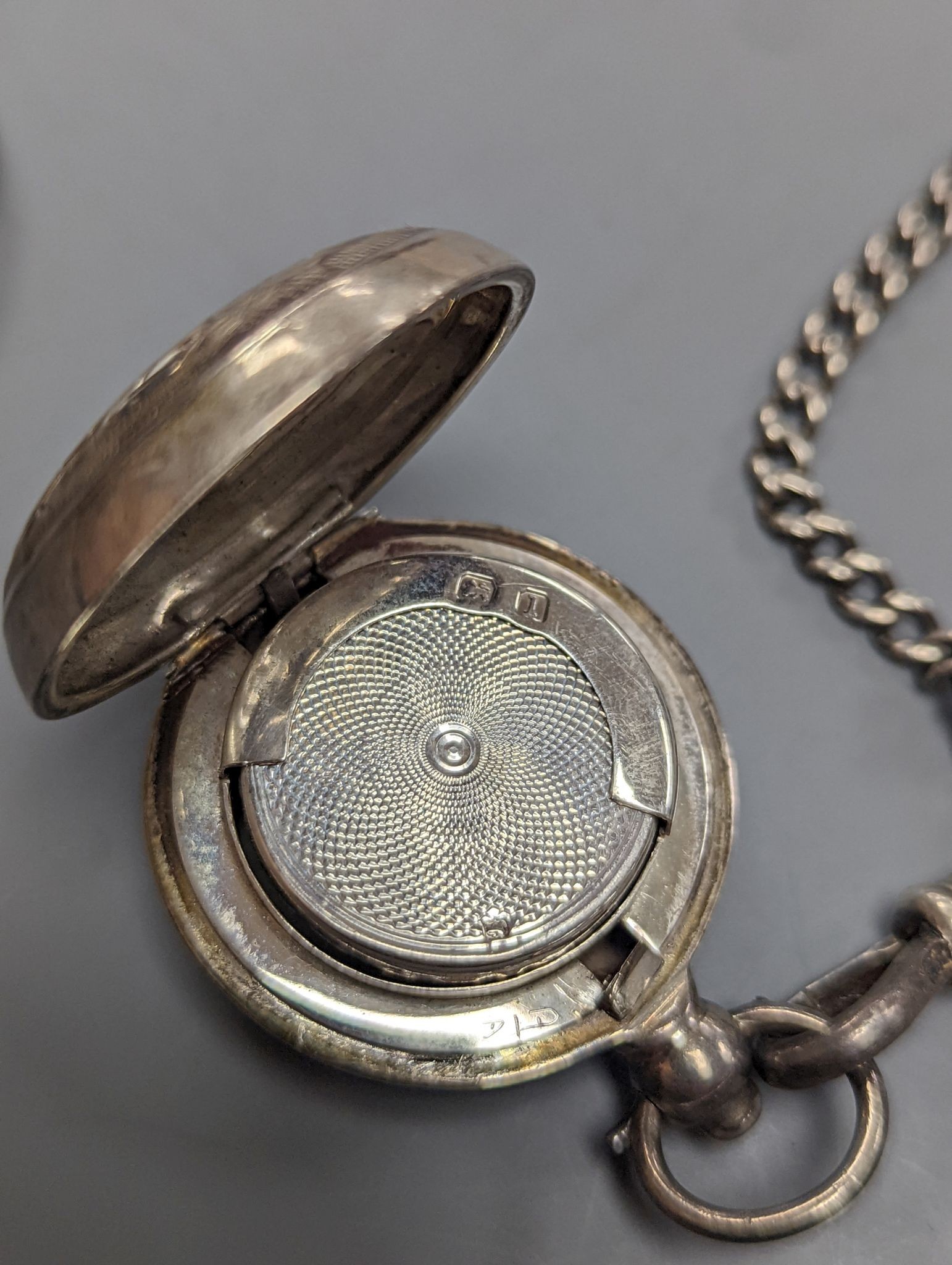 A George V engraved silver sovereign case, Birmingham, 1910, 29mm and a pair of gold plated lorgnettes.